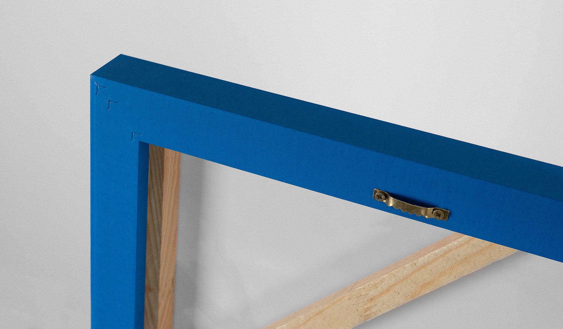 painting with a blue frame with a conveniet hanger