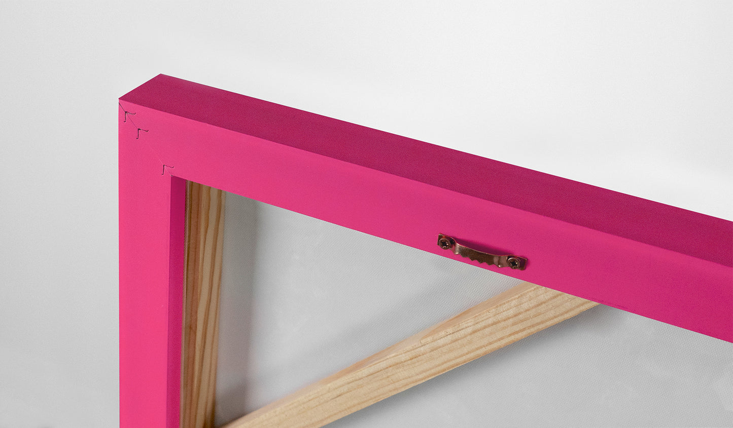 painting with a pink frame with a conveniet hanger