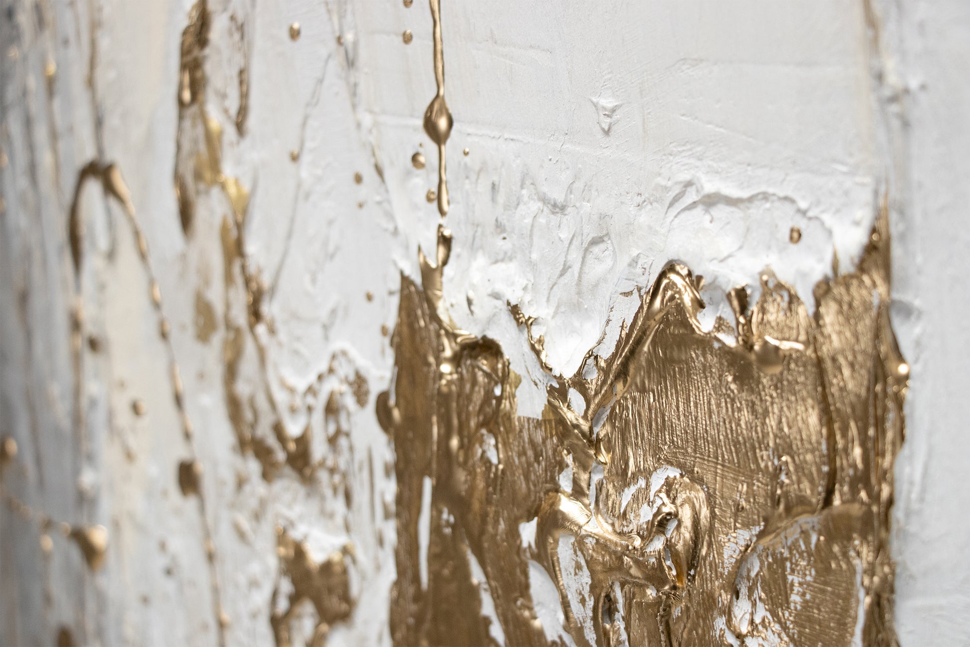 gold splash on white acrylic texture